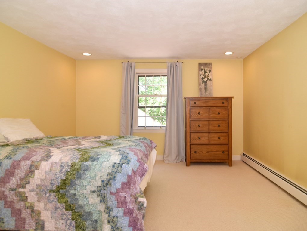 3 Violet Circle Milford, MA 01757 - Photo 25 of 41 a bedroom with a bed and a dresser