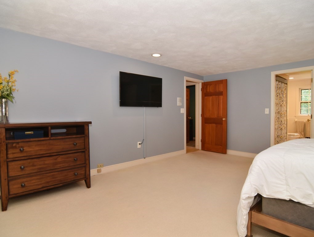3 Violet Circle Milford, MA 01757 - Photo 29 of 41 a bedroom with a bed and a flat screen tv