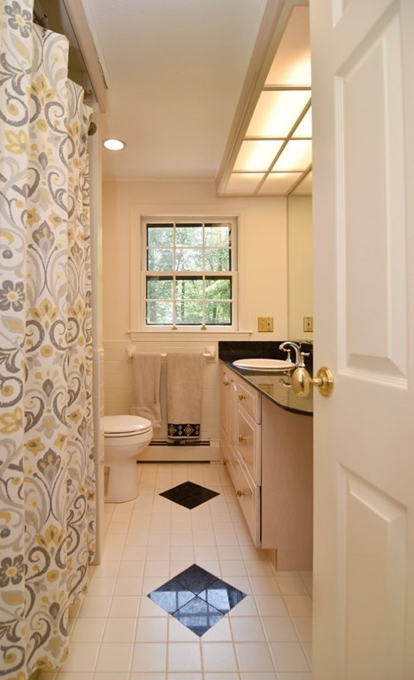 3 Violet Circle Milford, MA 01757 - Photo 32 of 41 a kitchen with a sink a stove a window and a dining table