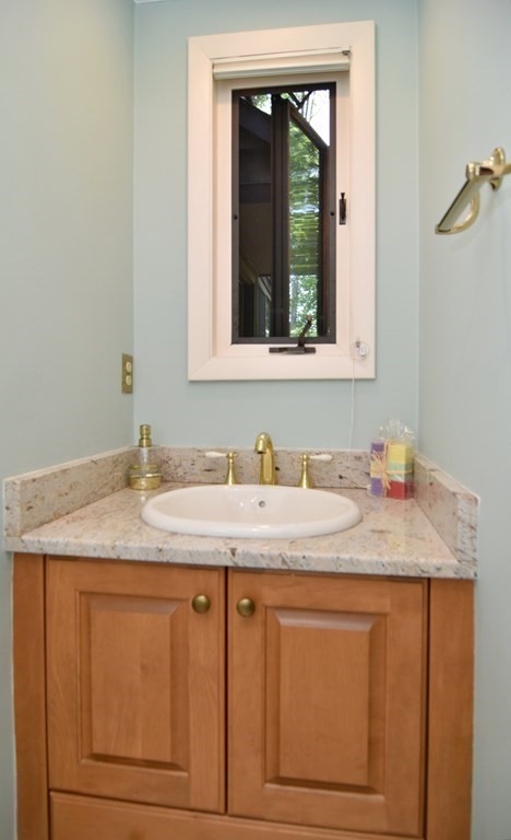 3 Violet Circle Milford, MA 01757 - Photo 33 of 41 a bathroom with a granite countertop sink and a window