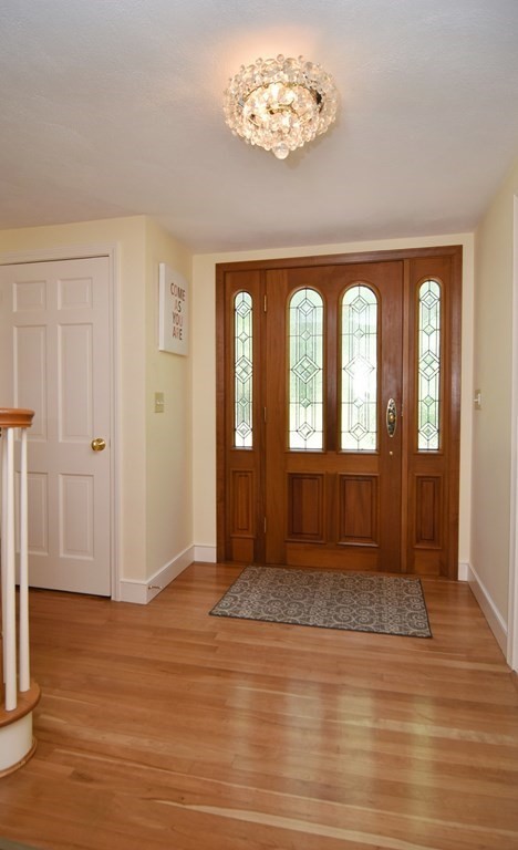 3 Violet Circle Milford, MA 01757 - Photo 35 of 41 an empty room with wooden floor and windows
