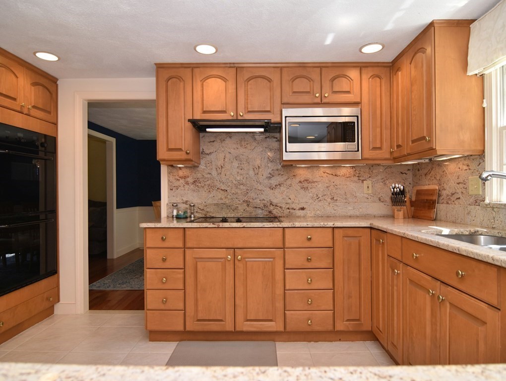 3 Violet Circle Milford, MA 01757 - Photo 8 of 41 a kitchen with stainless steel appliances granite countertop a sink and a microwave