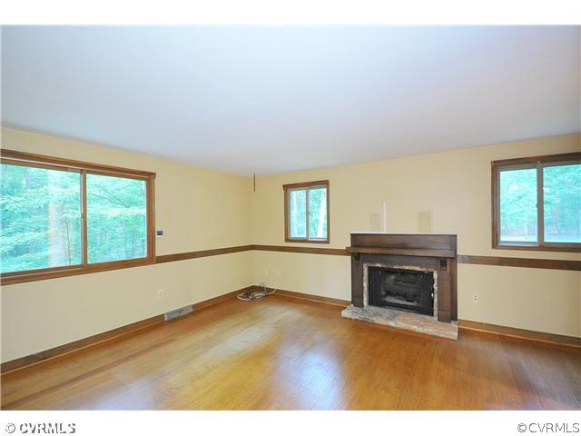 2100 Maidens Road Maidens, VA 23102 - Photo 10 of 24 a view of empty room with wooden floor and fireplace