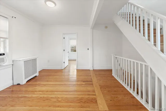 a view of an entryway with wooden floor