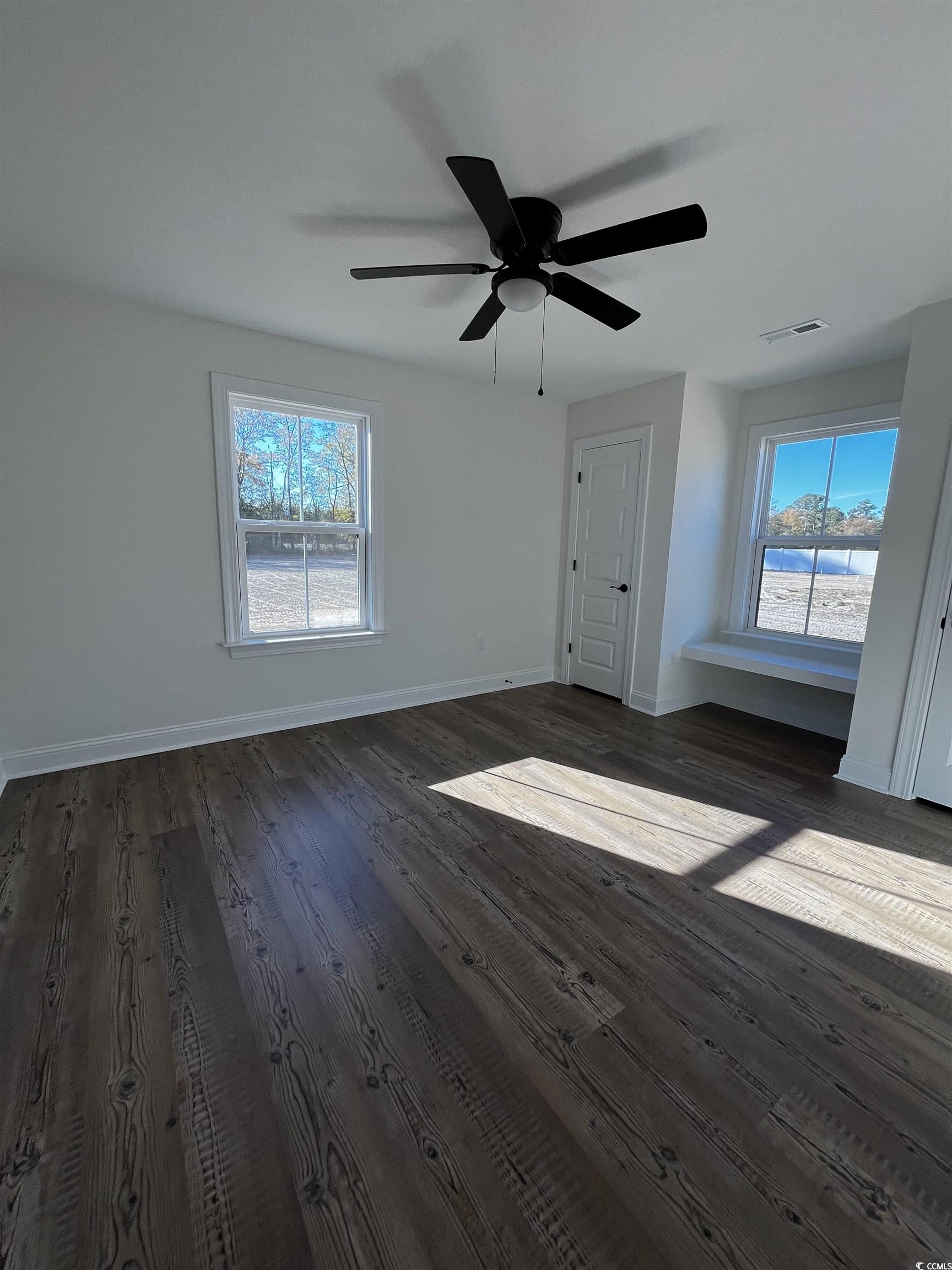3440 Asbury Road Aynor, SC 29511 - Photo 9 of 9 Unfurnished bedroom featuring a ceiling fan and dark wood-type flooring