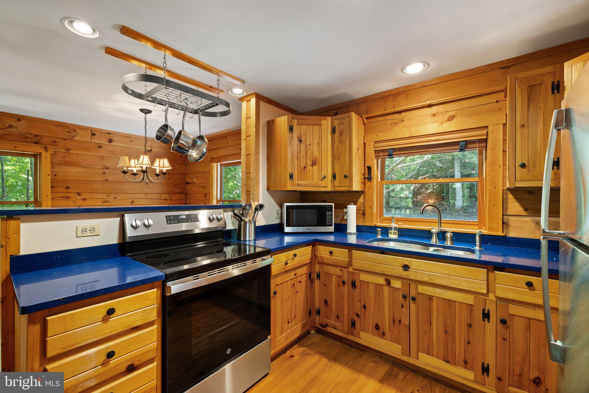47 Gore Road Castleton, VA 22716 - Photo 12 of 46 a kitchen with stainless steel appliances a sink and cabinets