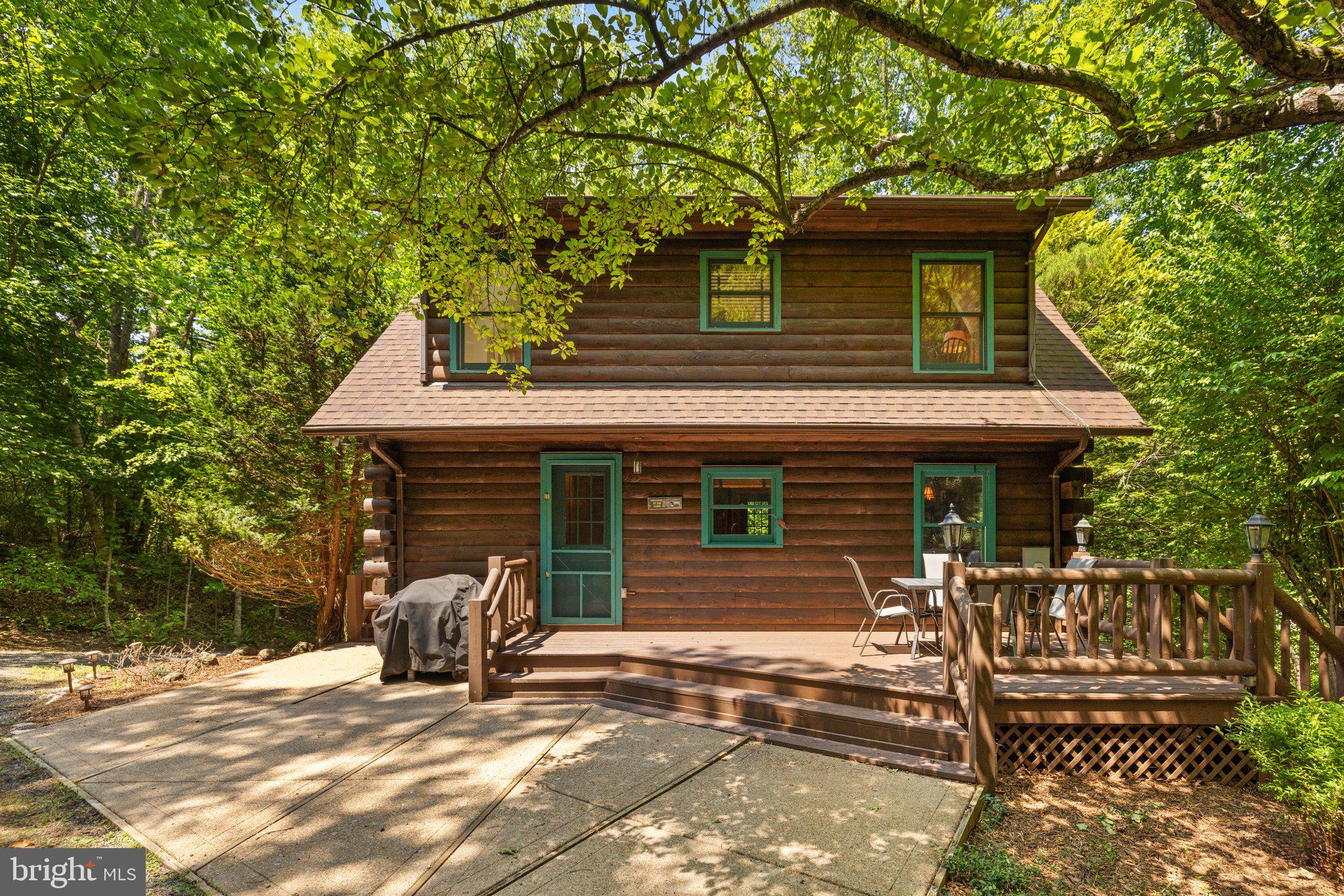 47 Gore Road Castleton, VA 22716 - Photo 46 of 46 a view of a house with backyard and a tree
