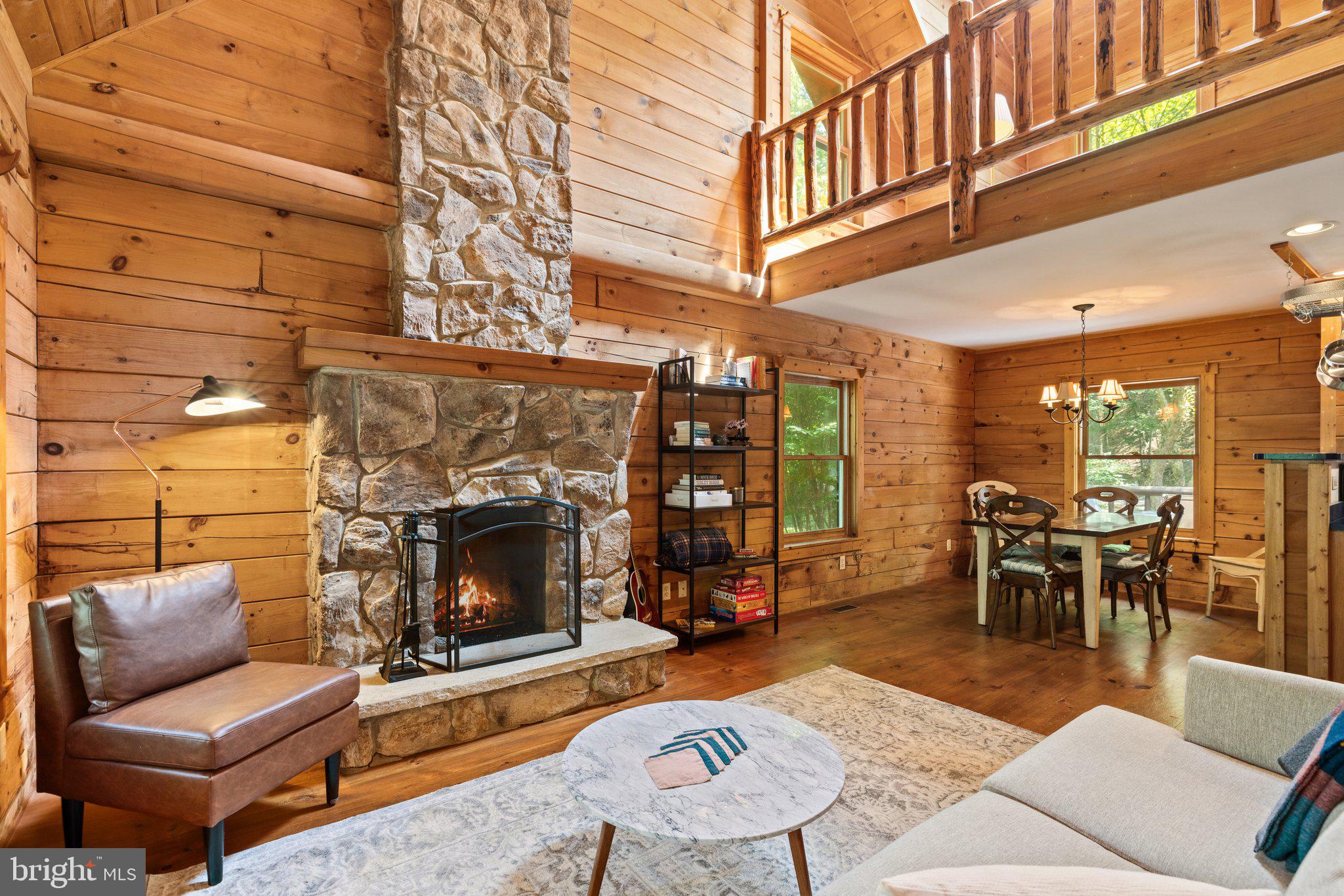 47 Gore Road Castleton, VA 22716 - Photo 5 of 46 a living room with furniture a fireplace and dining room view
