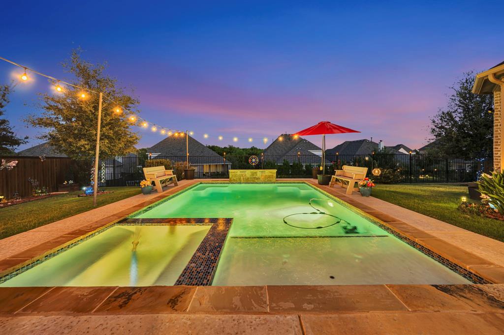 11305 Misty Ridge Drive Flower Mound, TX 76262 - Photo 2 of 40 Gorgeous pool with spa, tanning ledge, and water feature.