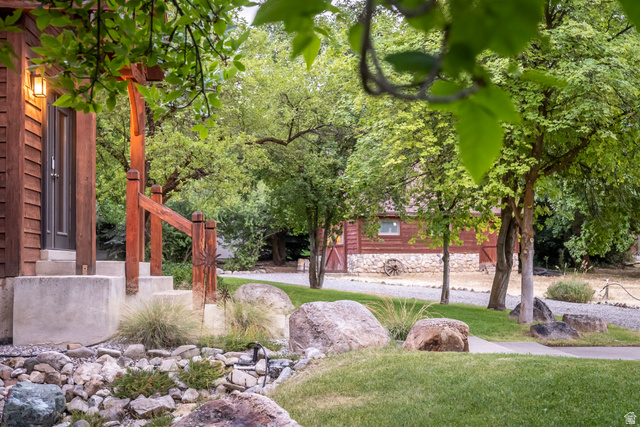 435 Canyon Road Millville, UT 84326 - Photo 6 of 113 Exterior featuring wood siding, concrete steps, and a wooden railing