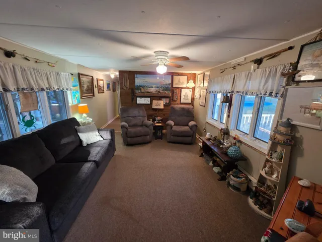 a living room with furniture gym equipment and a window