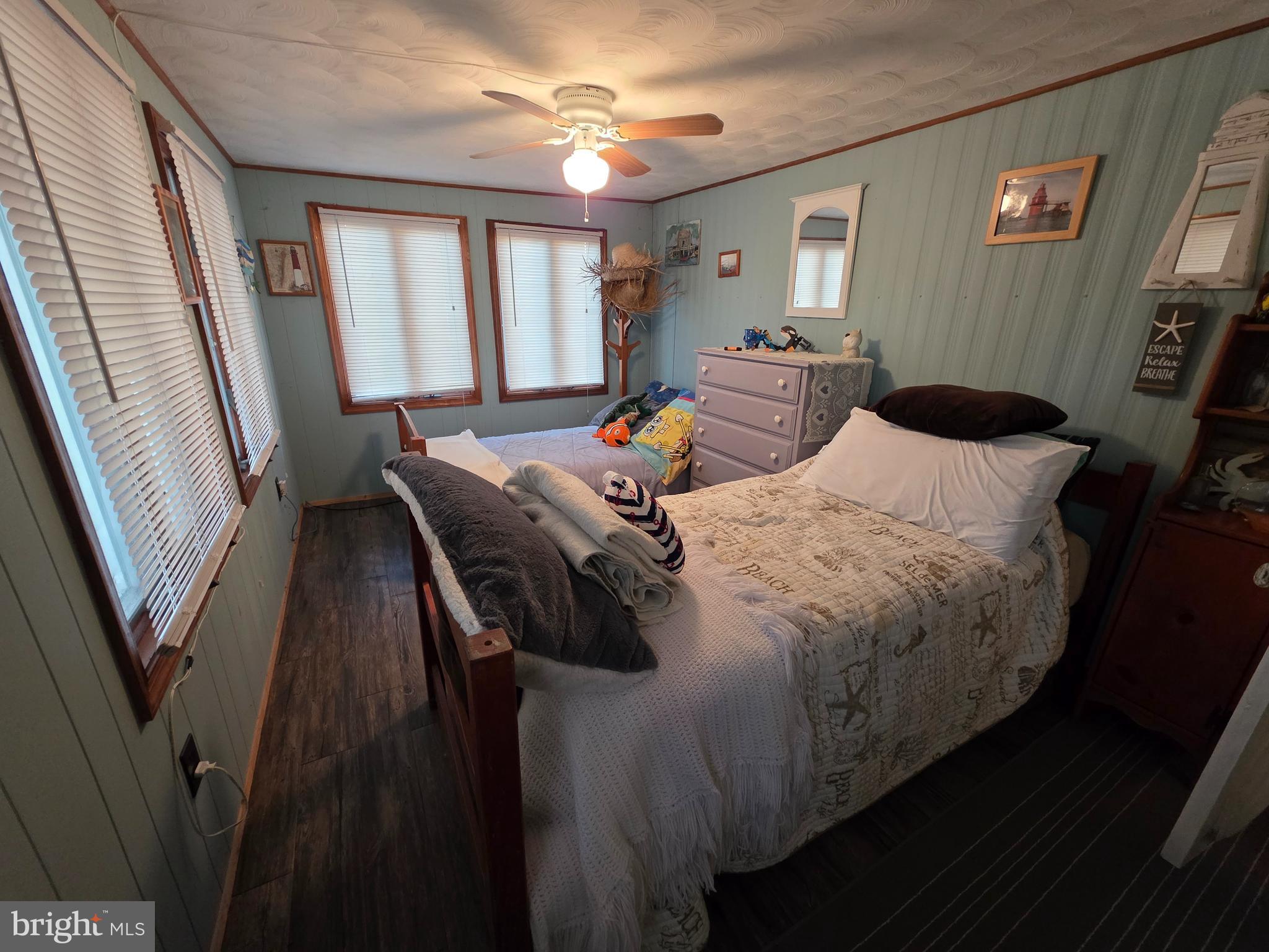 21 Vassar Avenue Fortescue, NJ 08321 - Photo 23 of 44 a bedroom with a bed and a large mirror on the dresser