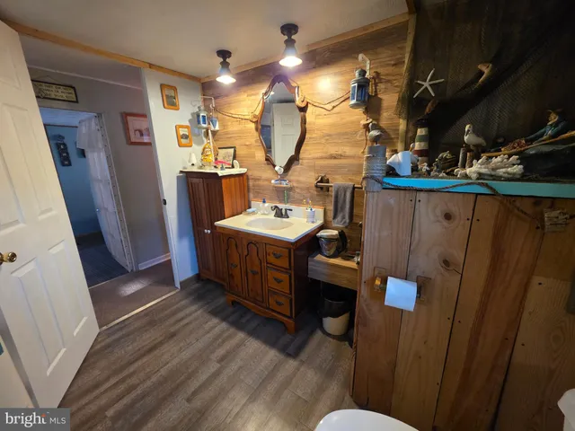 a view of a door and wooden floor