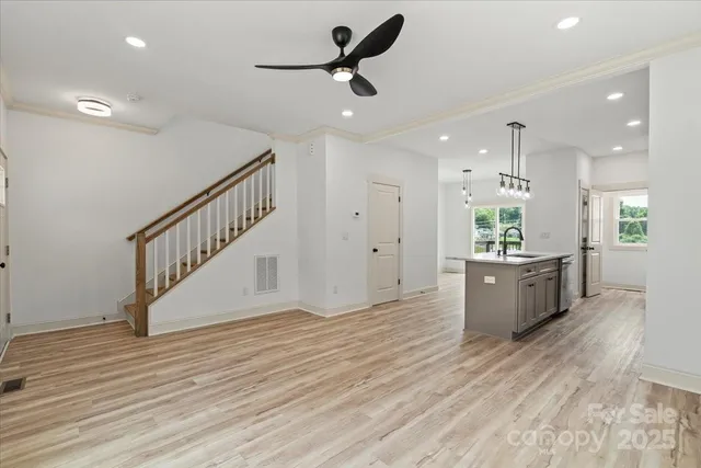 a view of kitchen and sink with wooden floor