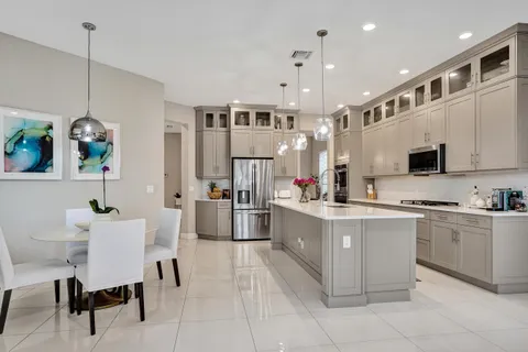 view of a swimming pool with potted plants