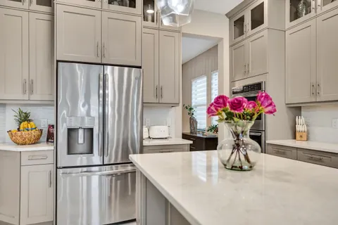 an aerial view of residential houses with outdoor space and swimming pool