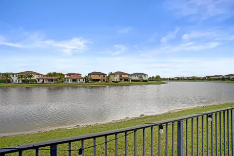 a large kitchen with kitchen island a sink stainless steel appliances and cabinets