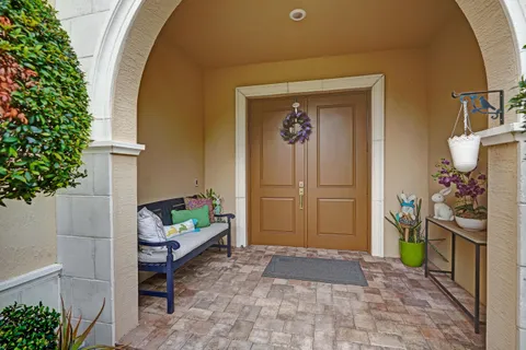 a kitchen with granite countertop a sink and white cabinets