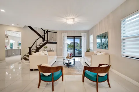 a kitchen with stainless steel appliances a refrigerator sink and cabinets