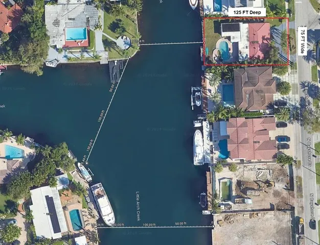 an aerial view of waterside residential houses with outdoor space