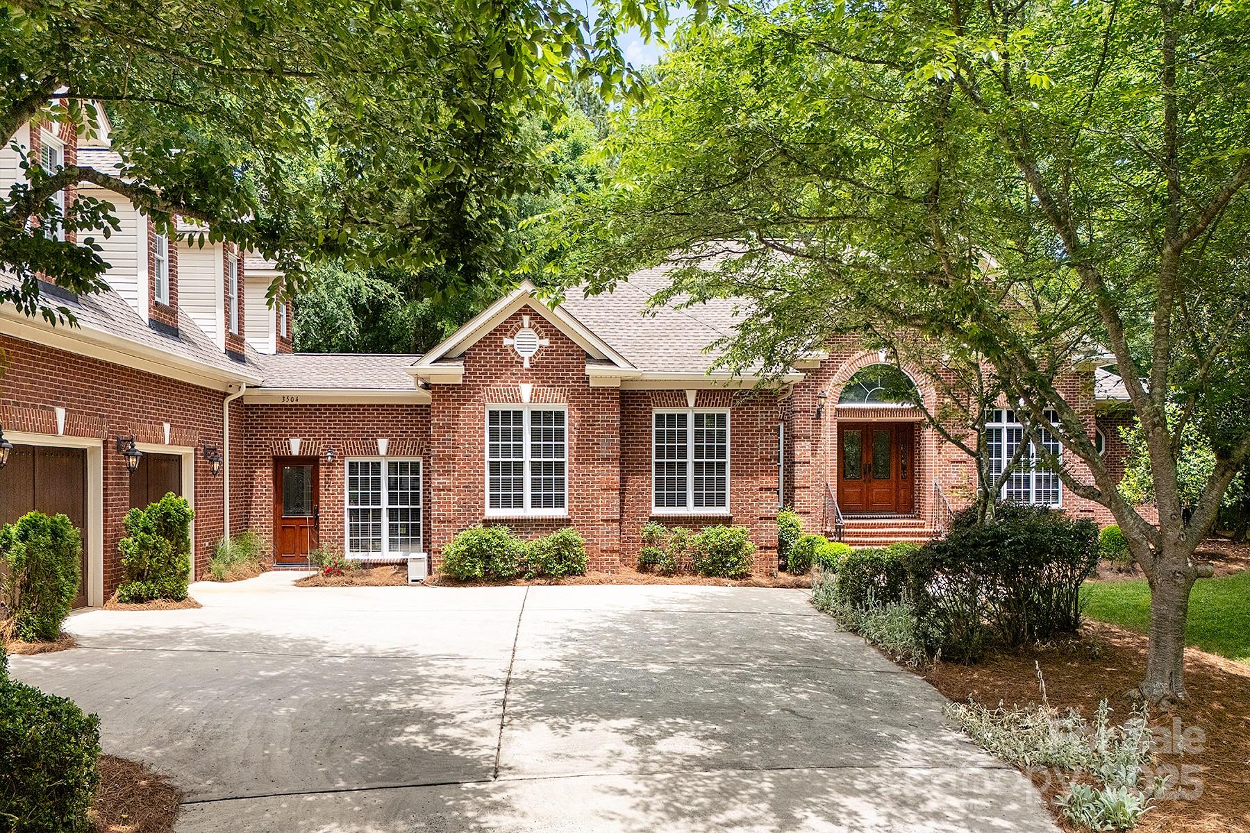 3504 High Ridge Road Charlotte, NC 28270 - Photo 1 of 36 a front view of a house with garden