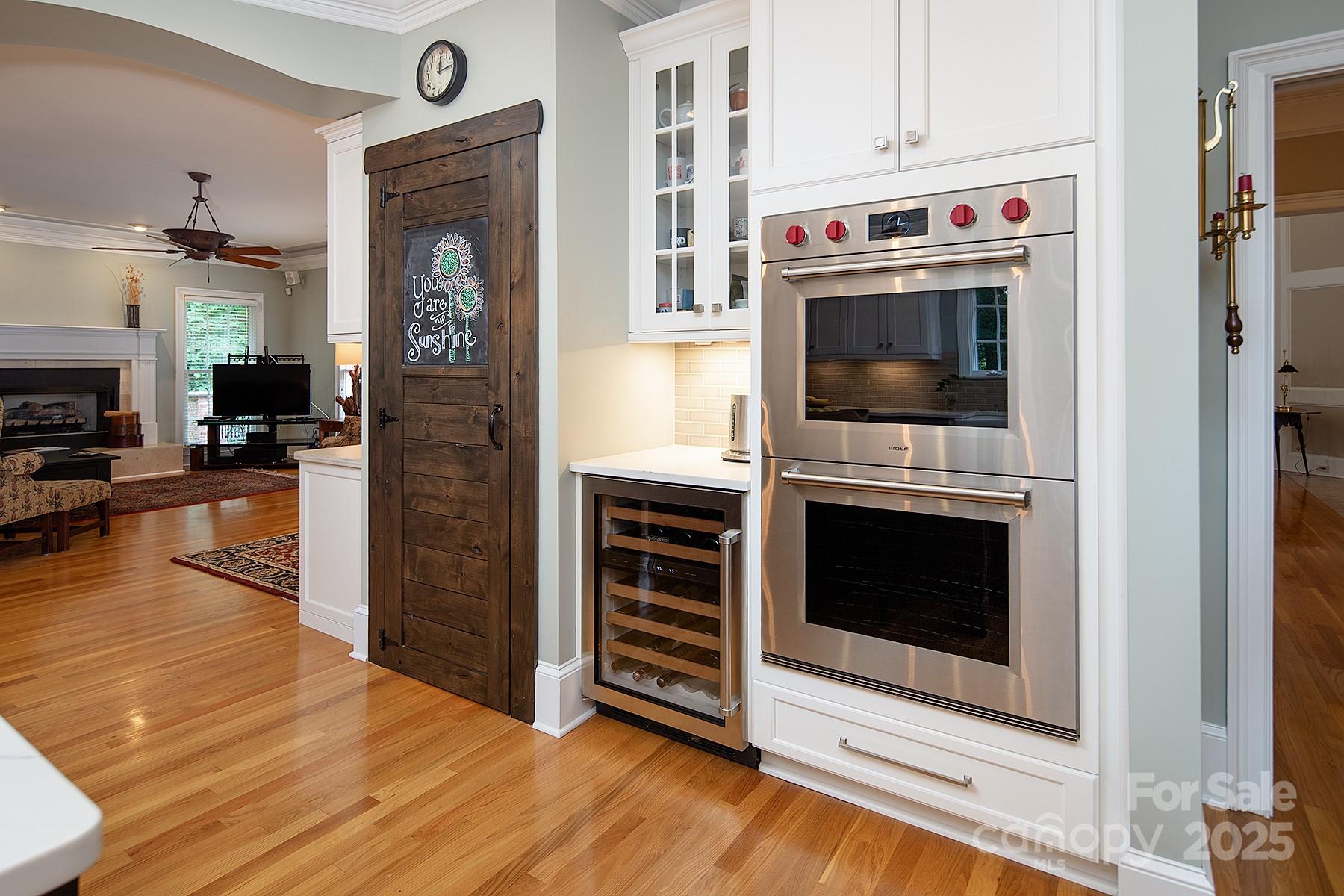 3504 High Ridge Road Charlotte, NC 28270 - Photo 13 of 36 a living room with stainless steel appliances furniture a fireplace and wooden floor