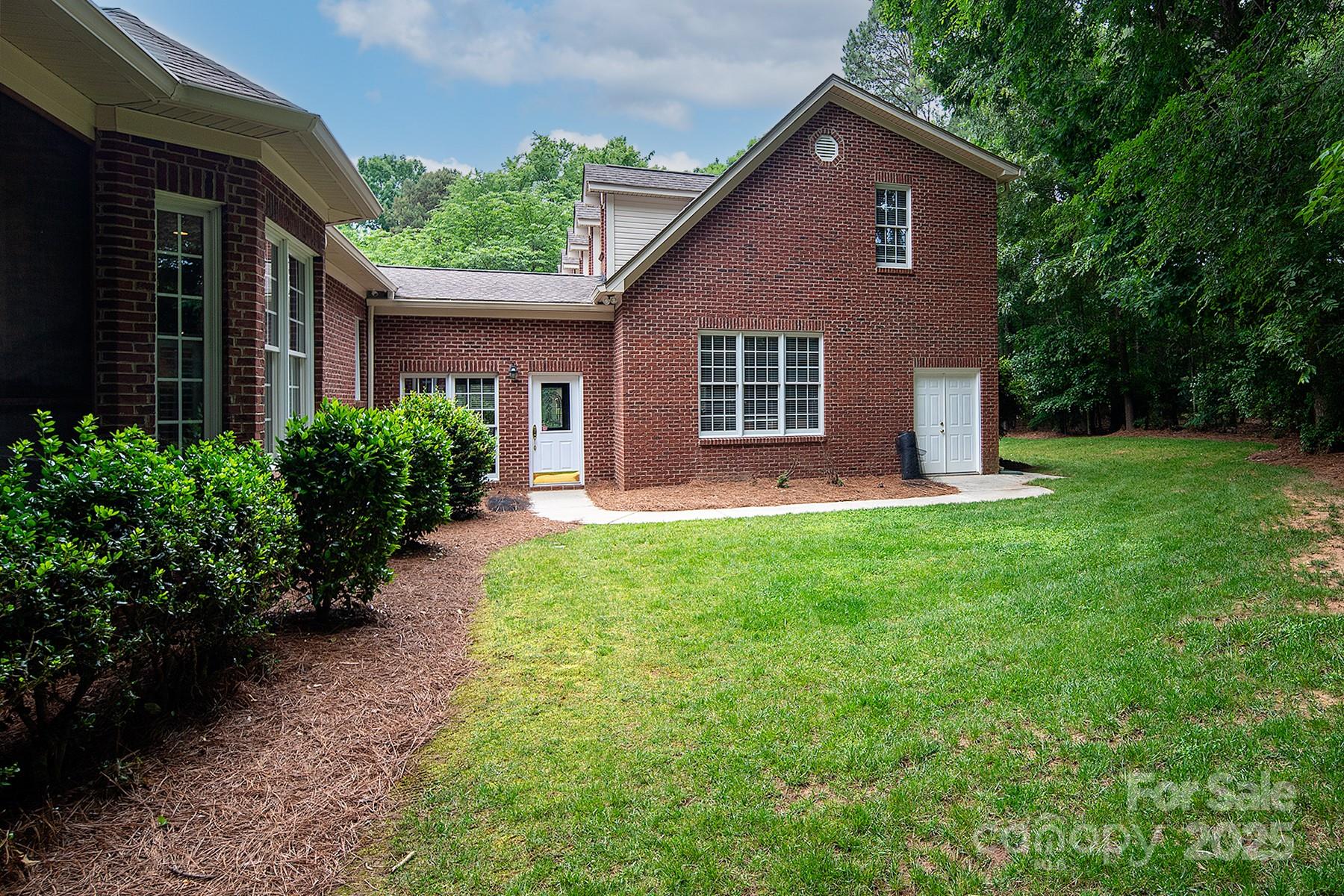 3504 High Ridge Road Charlotte, NC 28270 - Photo 33 of 36 a front view of a house with a yard and porch