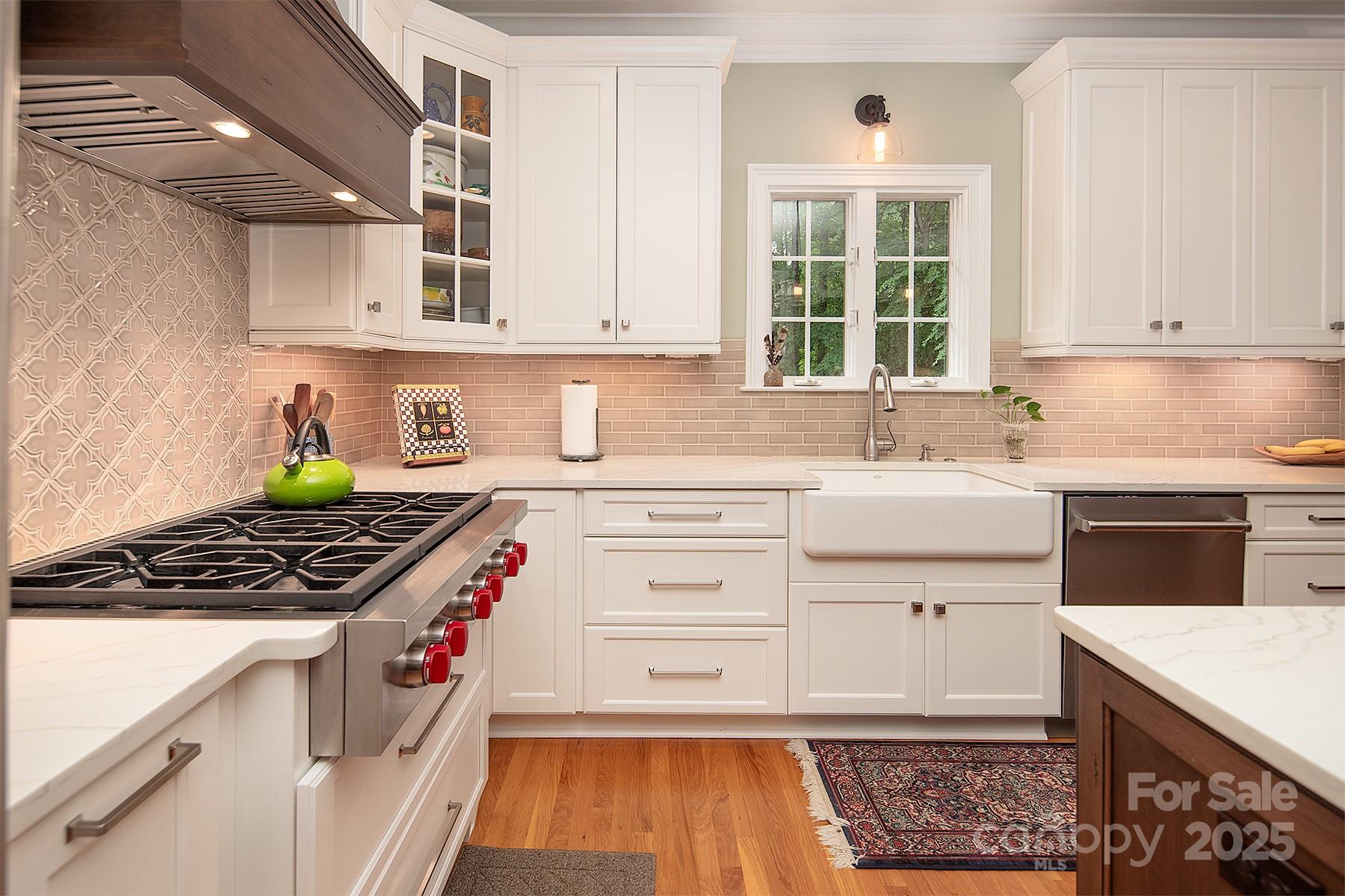 3504 High Ridge Road Charlotte, NC 28270 - Photo 10 of 36 a kitchen with white cabinets stove and sink