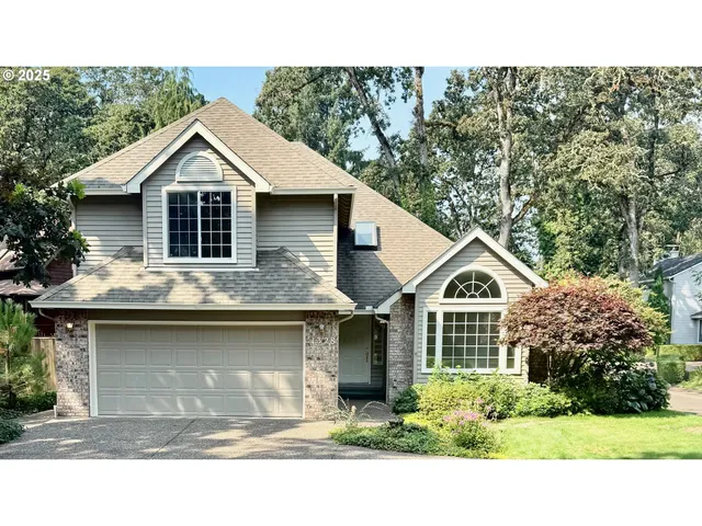 a aerial view of a house with a yard