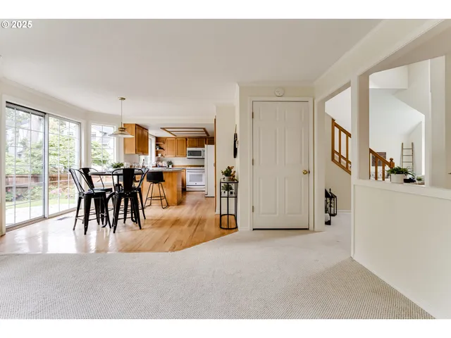 a view of a livingroom with furniture and a large window