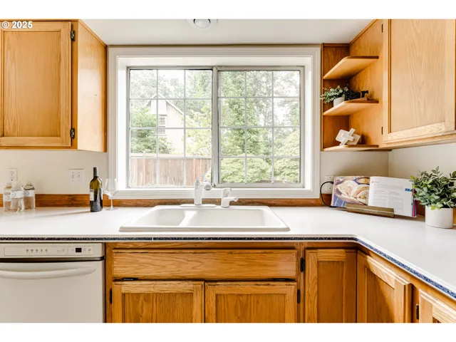 a bathroom with a sink and a window