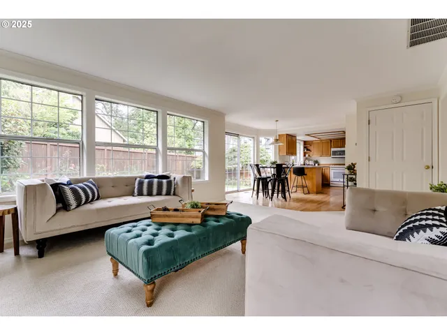 a living room with furniture and a table