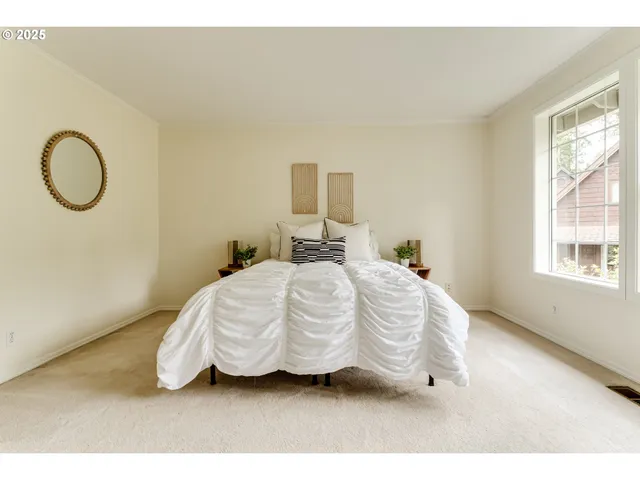 a bedroom with a bed and window