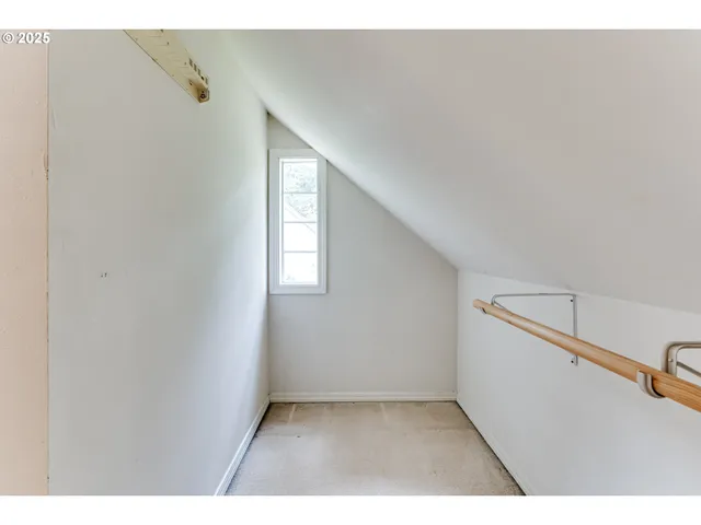 a view of an empty room with windows