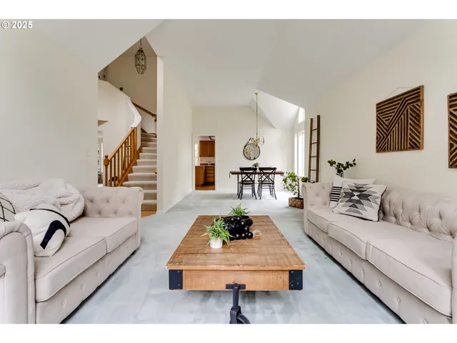 a living room with furniture rug and white walls