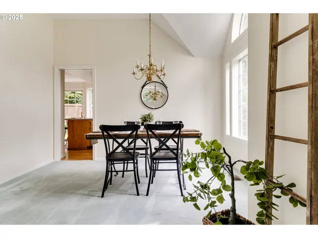 a view of a dining room with furniture and a table
