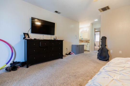 517 Randall Street Ridgecrest, CA 93555 - Photo 24 of 28 a room with furniture and flat screen tv