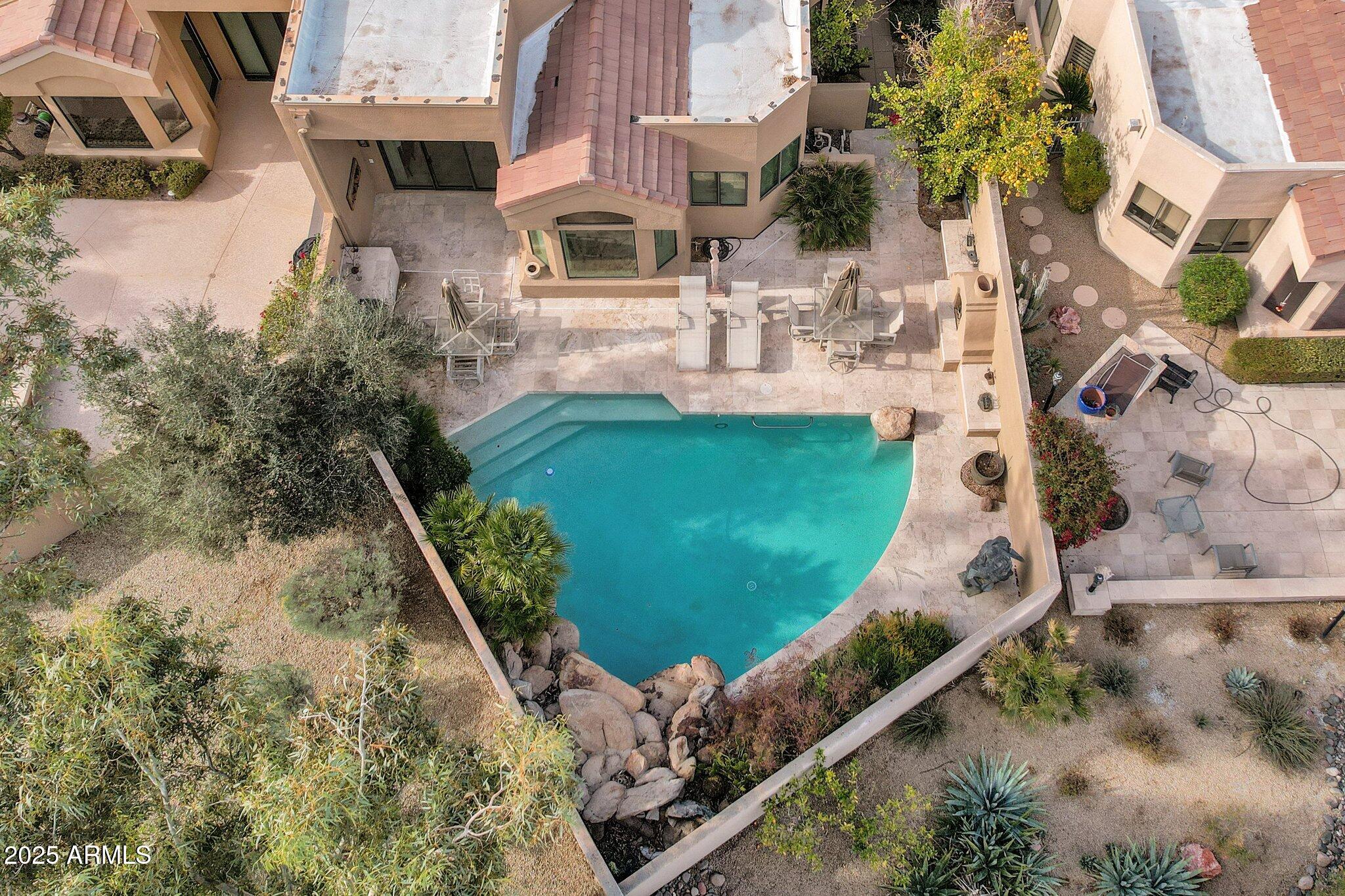 7740 East Gainey Ranch Road, Unit 36 Scottsdale, AZ 85258 - Photo 31 of 54 an aerial view of a house with outdoor space