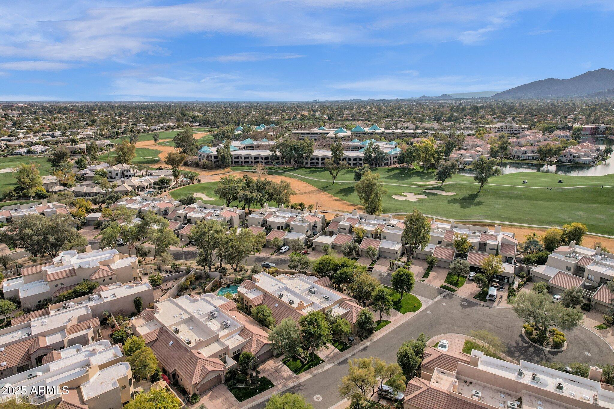 7740 East Gainey Ranch Road, Unit 36 Scottsdale, AZ 85258 - Photo 36 of 54 an aerial view of a city with lots of residential buildings