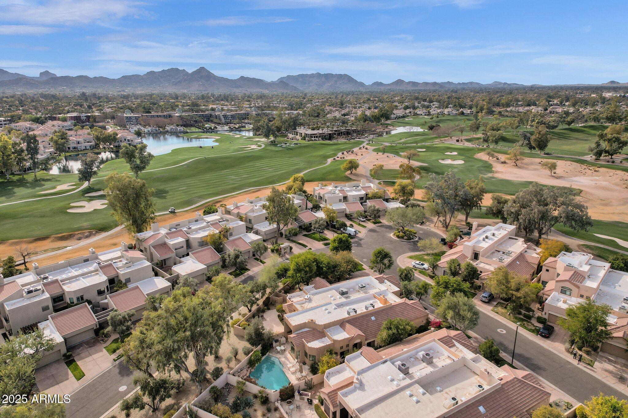 7740 East Gainey Ranch Road, Unit 36 Scottsdale, AZ 85258 - Photo 38 of 54 an aerial view of a city with lots of residential buildings