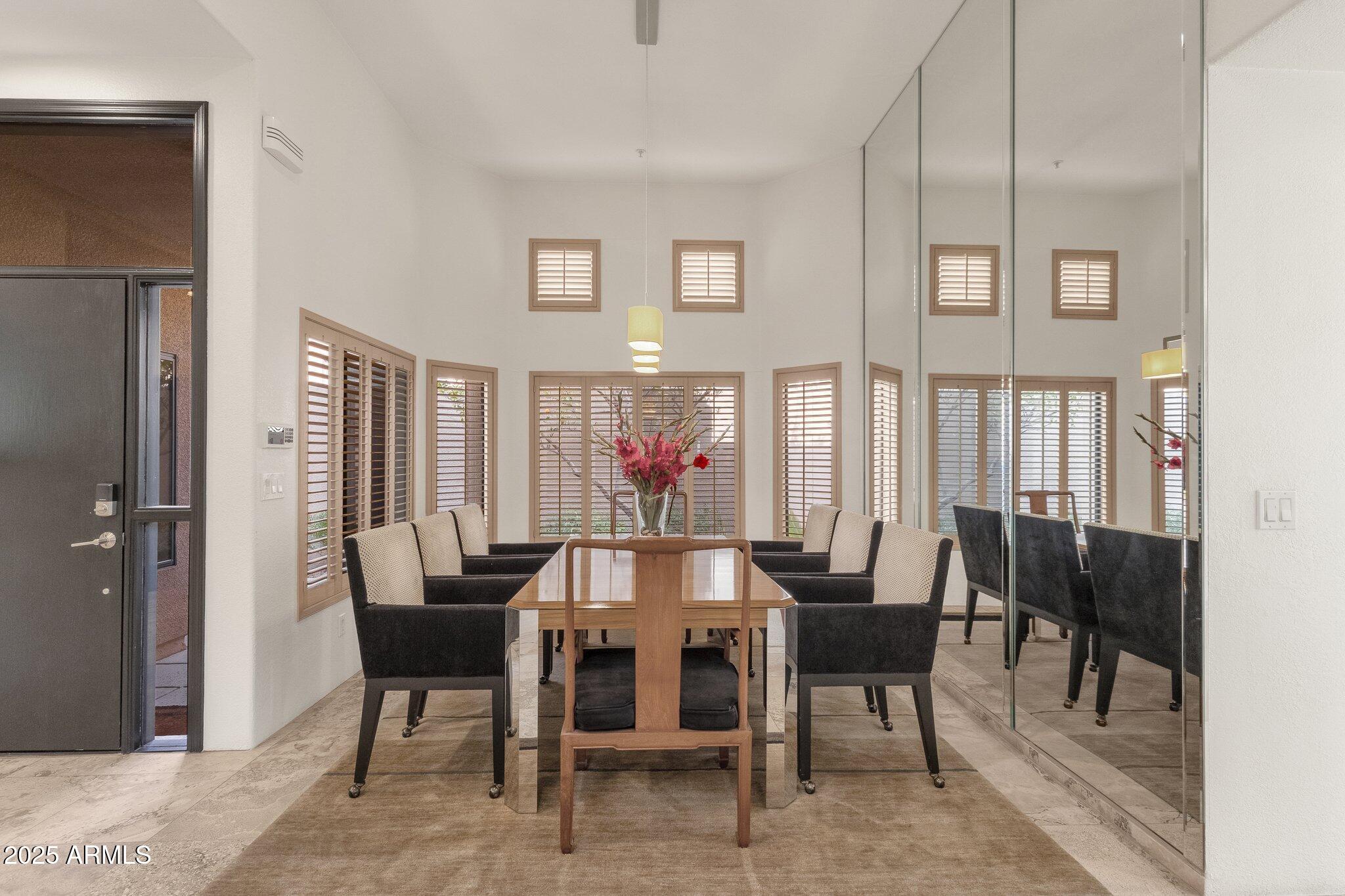 7740 East Gainey Ranch Road, Unit 36 Scottsdale, AZ 85258 - Photo 10 of 54 a view of a dining room with furniture and window