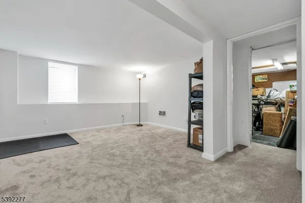 an empty room with a empty space and windows