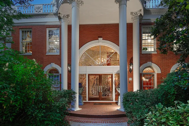 a front view of a house with garden