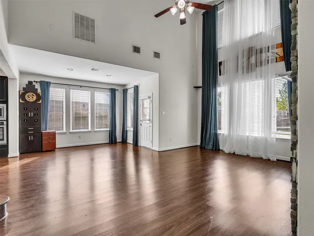 a view of an entryway with wooden floor