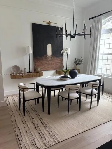 a view of a dining room with furniture and window