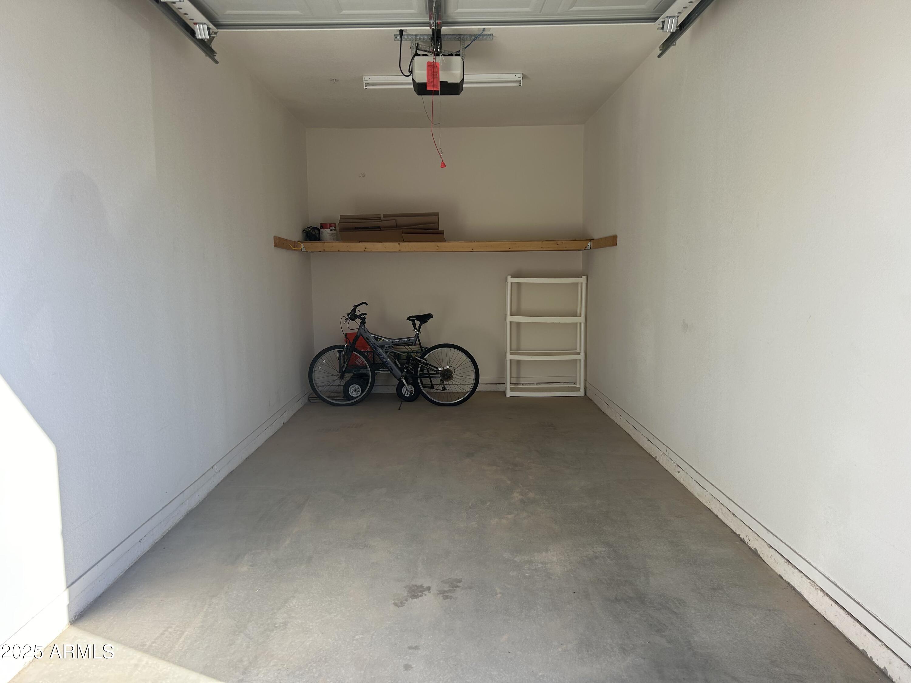 10136 East Southern Avenue, Unit 2048 Mesa, AZ 85209 - Photo 19 of 23 a view of a storage and utility room with racks on the wall