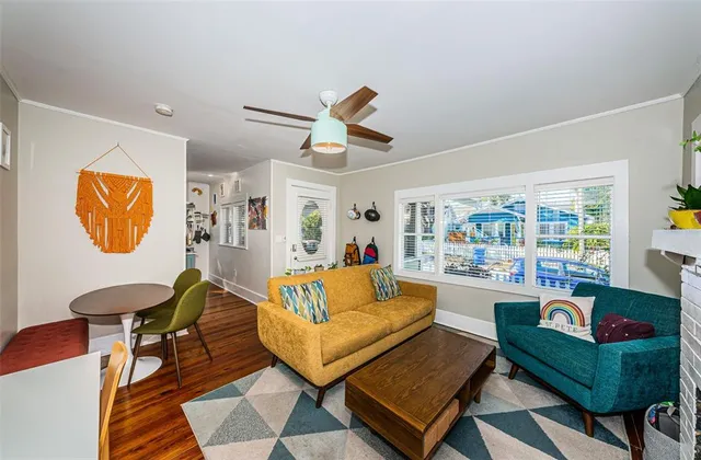 a living room with furniture and a rug