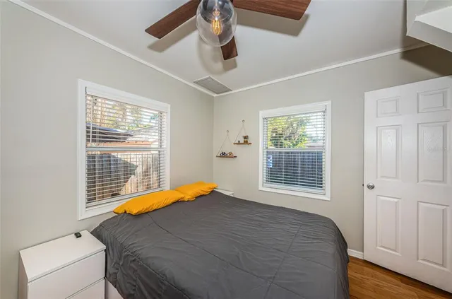 a bedroom with a bed and a window