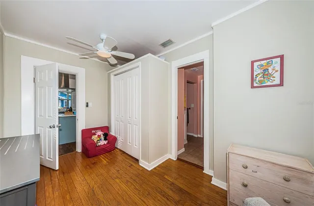 a bedroom with a bed and a dresser