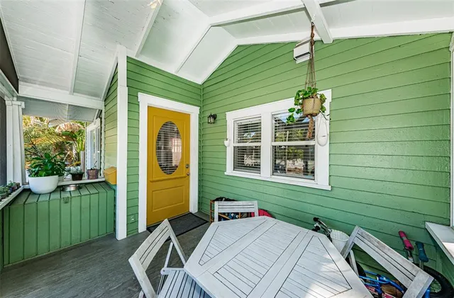 a balcony with furniture and a window
